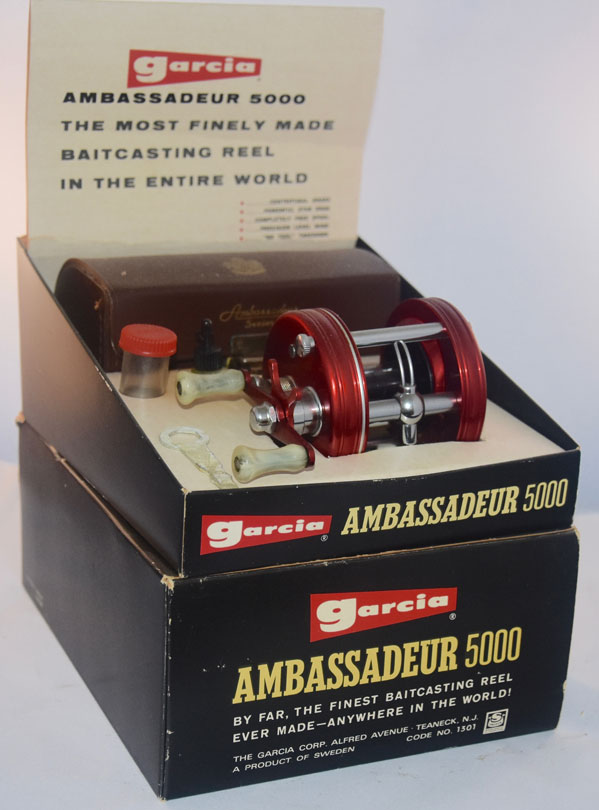 A Swedish Abu Garcia Ambassadeur 6000-C fishing reel and case, , a Mitchell  3000 A reel, a Spincast